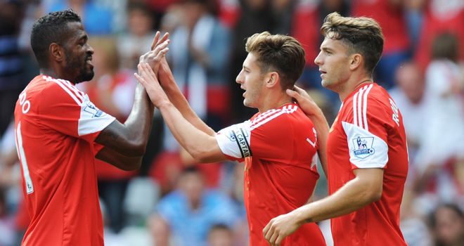 Adam Lallana celebrates with his Saints teammates