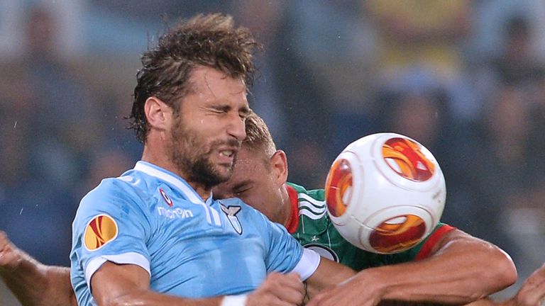 Lazio defender Lorik Cana fights for the ball