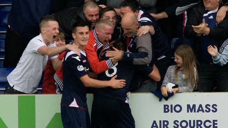 Richard Brittain celebrates his winner with the Ross County fans