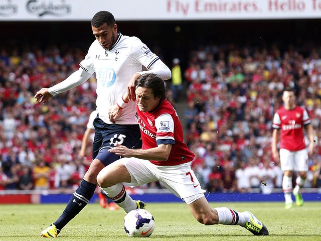 Dembele knocks Rosicky to the ground.