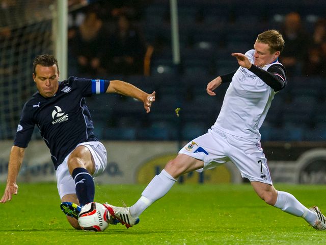 Gavin Rae challenges Billy McKay.