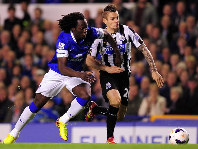 Romelu Lukaku takes on Mathieu Debuchy