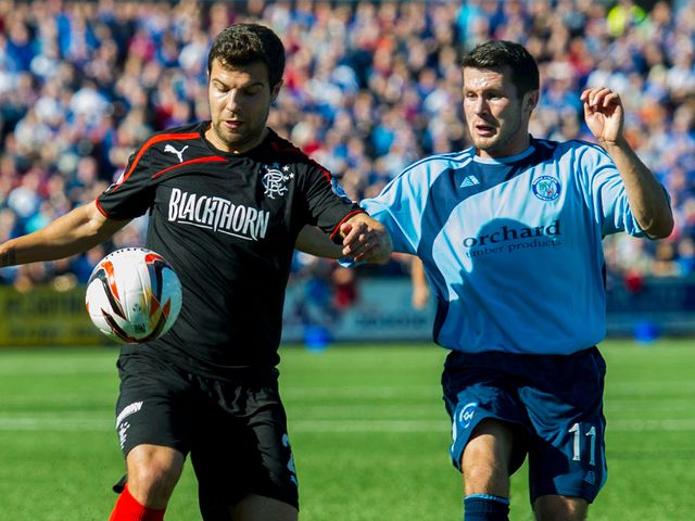 Richard Foster is kept in check by Dale Hilson
