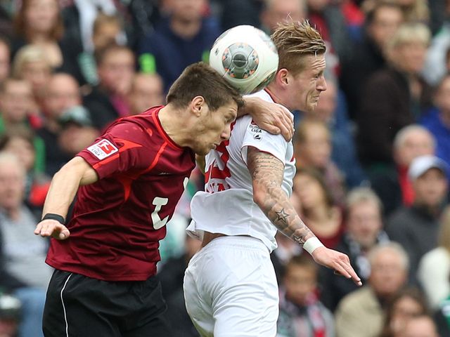 Sebastien Pocognoli and Andre Hahn battle for the ball