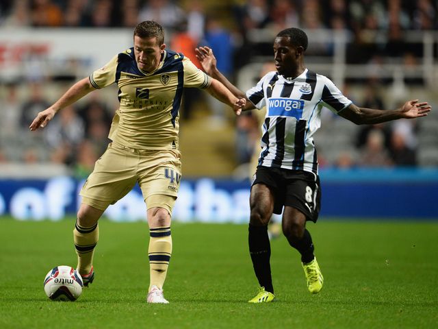 Ross McCormack keeps the ball away from Vurnon Anita
