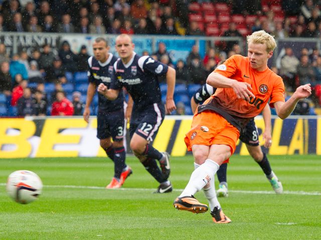 Gary Mackay-Steven slots home a penalty for Dundee United