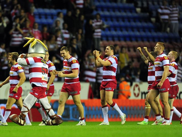 Wigan players celebrate victory over Leeds