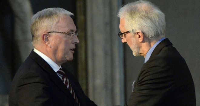 Brian Cookson, right, replaced Pat McQuaid, left, as UCI president last month