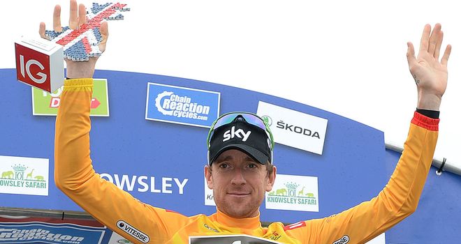 Bradley Wiggins is wearing the leader's gold jersey