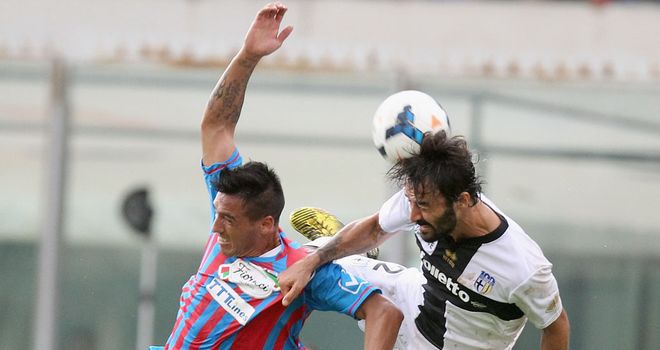 Fabian Monzon and Mattia Cassani contest a high ball