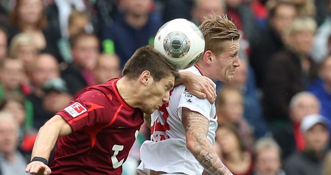 Sebastien Pocognoli and Andre Hahn battle for the ball