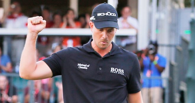 Henrik Stenson celebrates on the 18th green