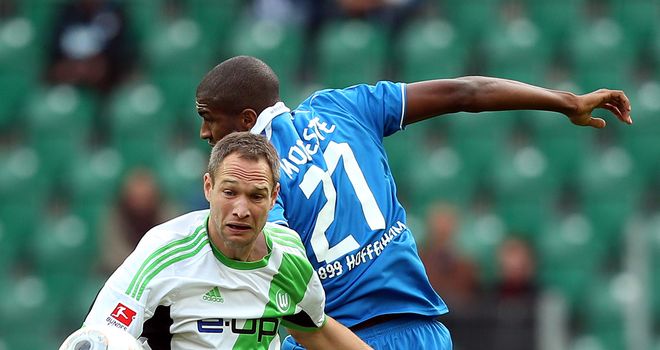 Jan Polak of Wolfsburg challenges Anthony Modeste of Hoffenheim