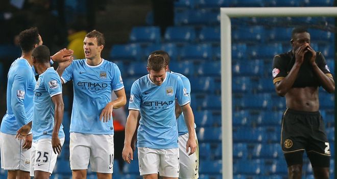 Edin Dzeko: Celebrates City's opener on Tuesday