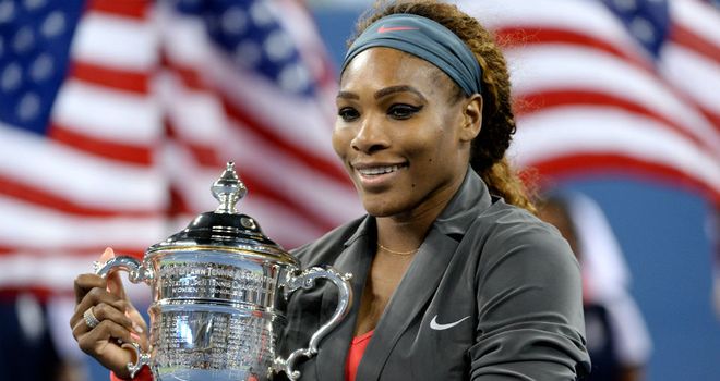 Williams poses with the trophy after coming through in a deciding set