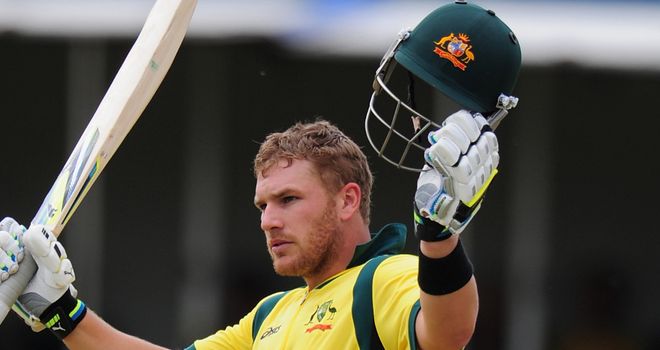 Aaron Finch celebrates his century