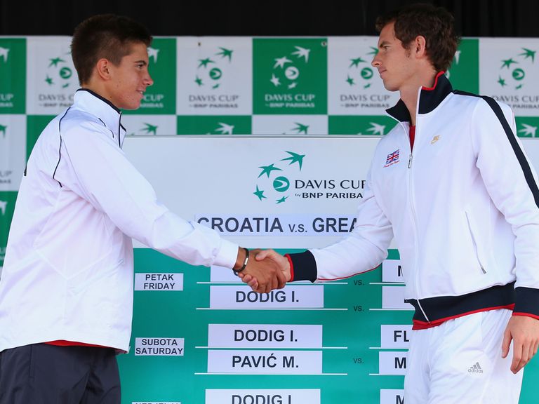 Borna Coric says hello to Andy Murray.