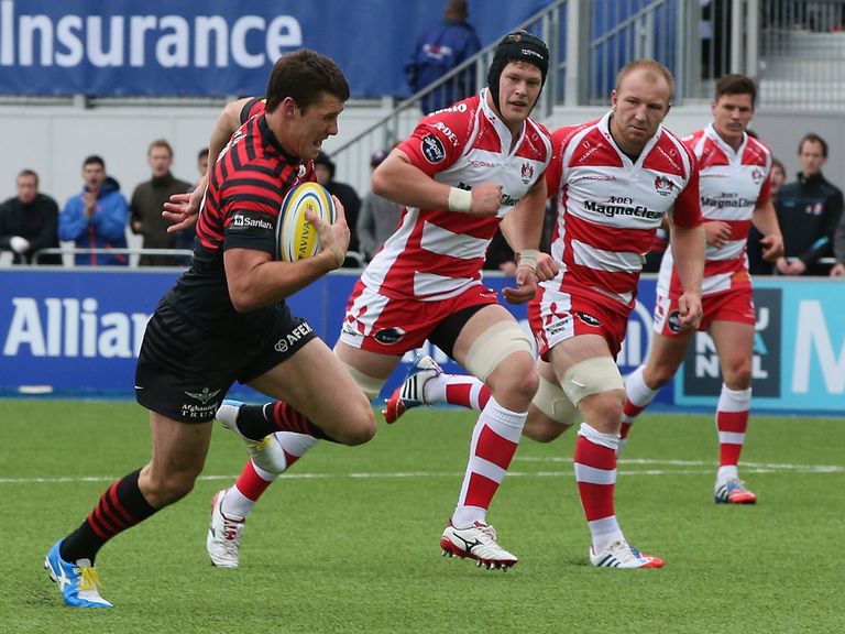Joel Tomkins sprints clear to score the opening try for Saracens