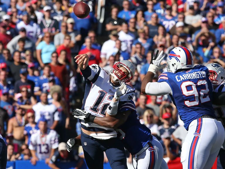 New England's Tom Brady throws under pressure