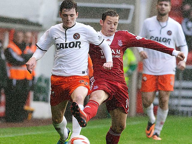 Andrew Robertson takes on Peter Pawlett