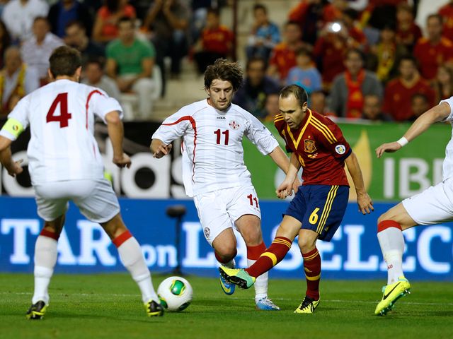 Andres Iniesta finds himself surrounded