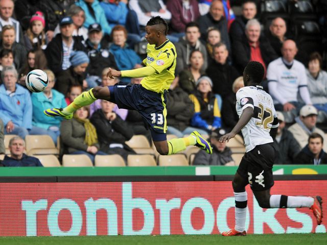 Demari Gray jumps to keep possession.