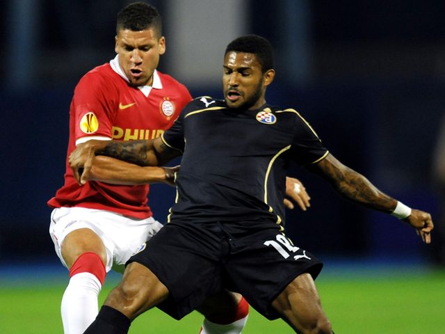 Adam Maher vies for the ball with Sammir