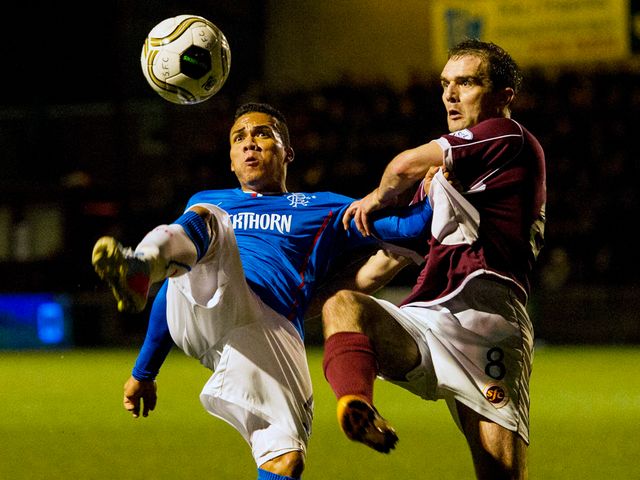 Arnold Peralta tussles with David Rowson