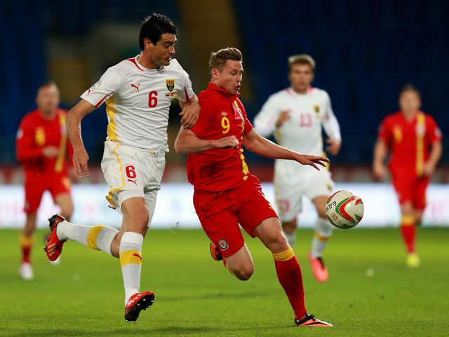 Simon Church tries to keep possession.