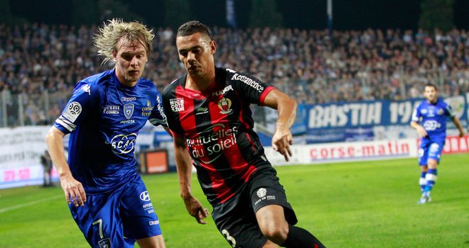 Milos Krasic vies with Thimothee Kolodziejczak.