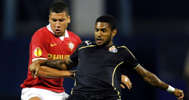 Adam Maher vies for the ball with Sammir