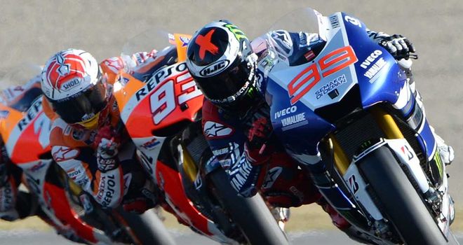 Jorge Lorenzo (R) keeps his nose in front of Marc Marquez in Japan
