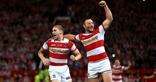 Sam Tomkins (left) and Blake Green celebrate Wigan's victory