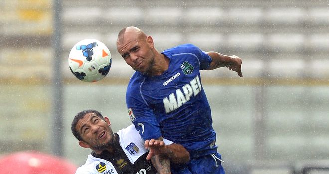 Parma's Walter Gargano and Sassuolo's Simone Zaza compete for a header
