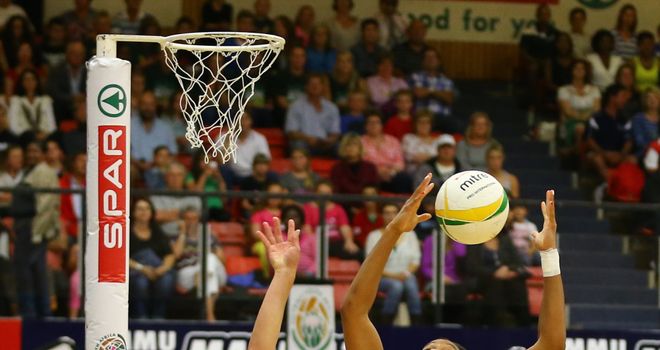 Adele Niemand (l) competes for the ball with Pamela Cookey