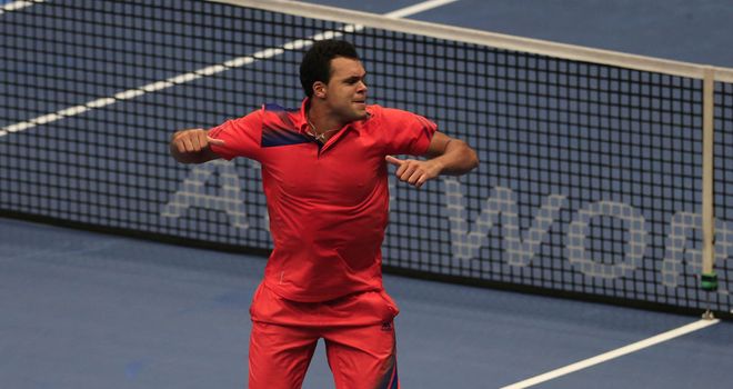 Jo-Wilfried Tsonga celebrates after overcoming Daniel Brands