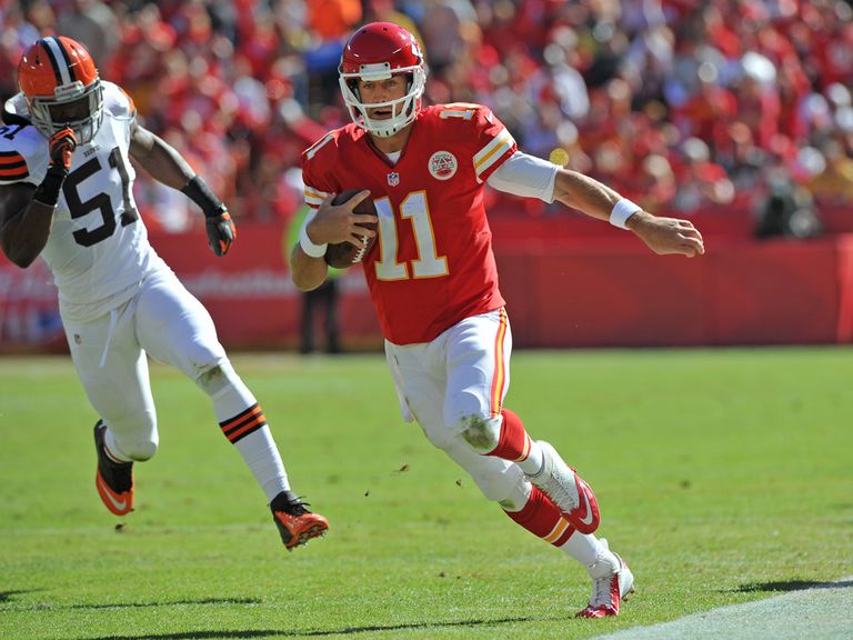 Alex Smith runs for a first down