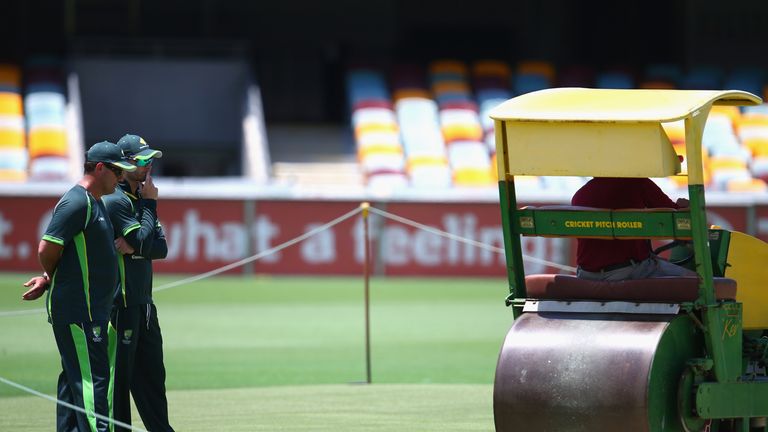 Michael Clarke and ex-captain Mark Taylor inspect the Gabba pitch