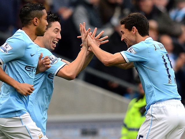 Samir Nasri celebrates with Jesus Navas