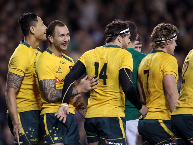 Australia celebrate Quade Cooper's try