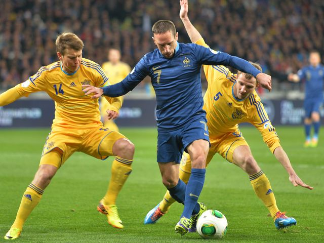 Franck Ribery battles for the ball against Ukraine