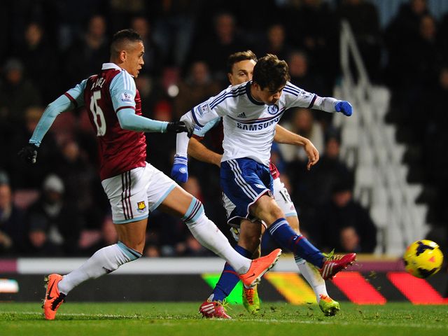 Oscar takes a shot under pressure from Ravel Morrison