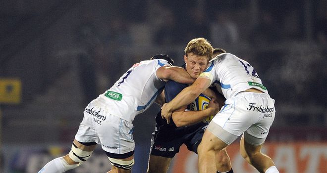 David Seymour is stopped in his tracks by Exeter duo Jason Shoemark and Sam Hill