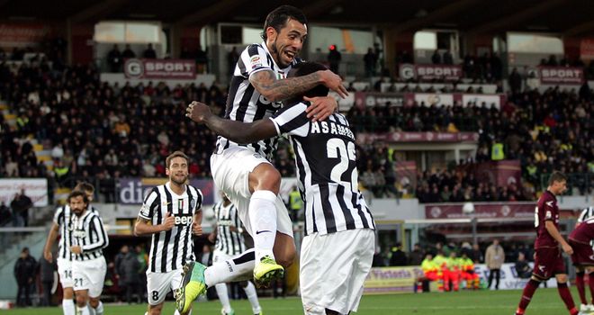 Carlos Tevez celebrates after finding the net for Juventus