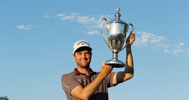 Chris Kirk poses with the trophy after winning The McGladrey Classic at Sea Island's Seaside Course