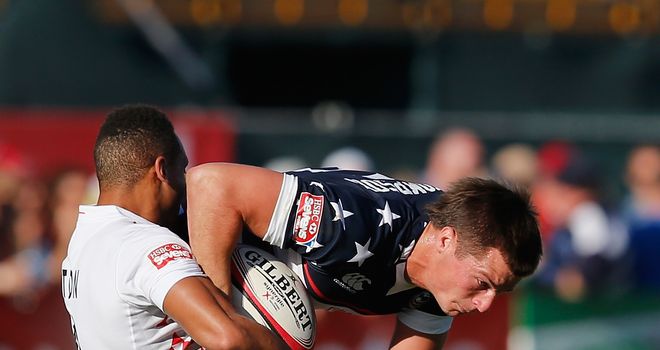 Brett Thompson of the United States is tackled by Dan Norton of England