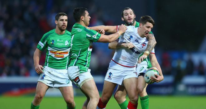 Simon Finnigan (r) tangles with England's Gareth Widdop