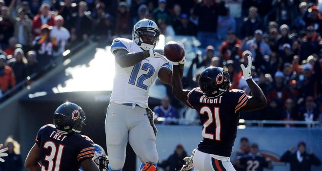 Major Wright of the Chicago Bears and Jeremy Ross of the Detroit Lions go up for the ball at Soldier Field