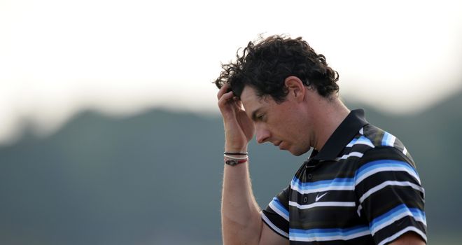 Rory McIlroy reacts to his bogey at the 18th hole in round two
