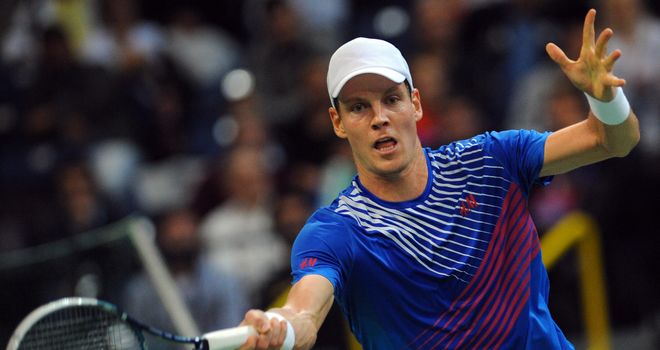 Tomas Berdych returns the ball to Serbia's Dusan Lajovic